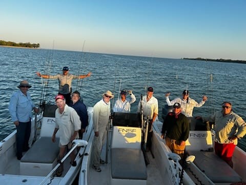 Group shot of guides and anglers on dories, Archer River, Cape York