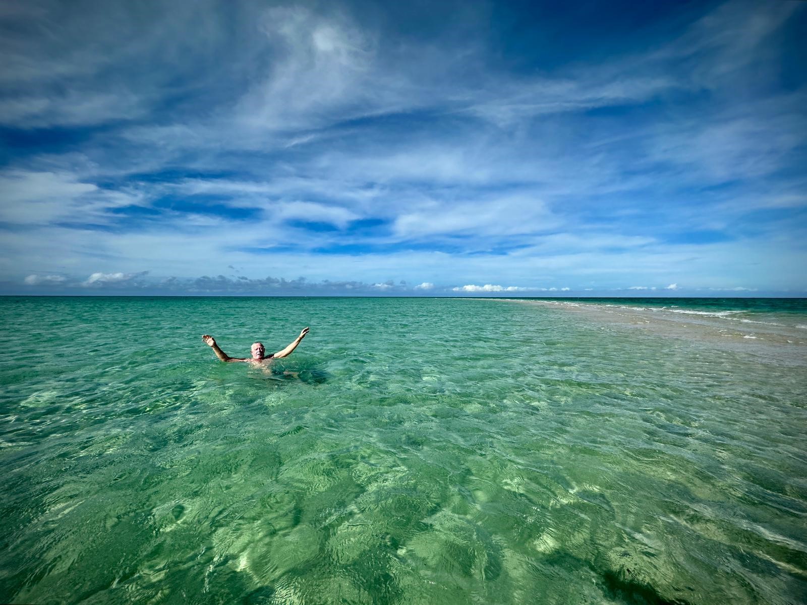 Swimming at remote sand cay Great Barrier Reef